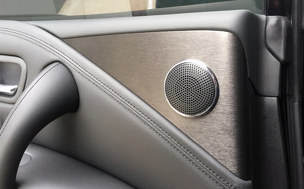 Pristine grey leather door card with brushed aluminium and chrome detail — Canberra Leather protective coatings
