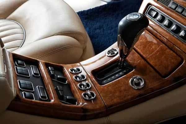 Restored burl walnut dashboard in a luxury European car — Canberra wood trim restoration